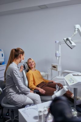 dentist-and-female-patient-in-her-office-2023-02-09-01-23-48-utc-min